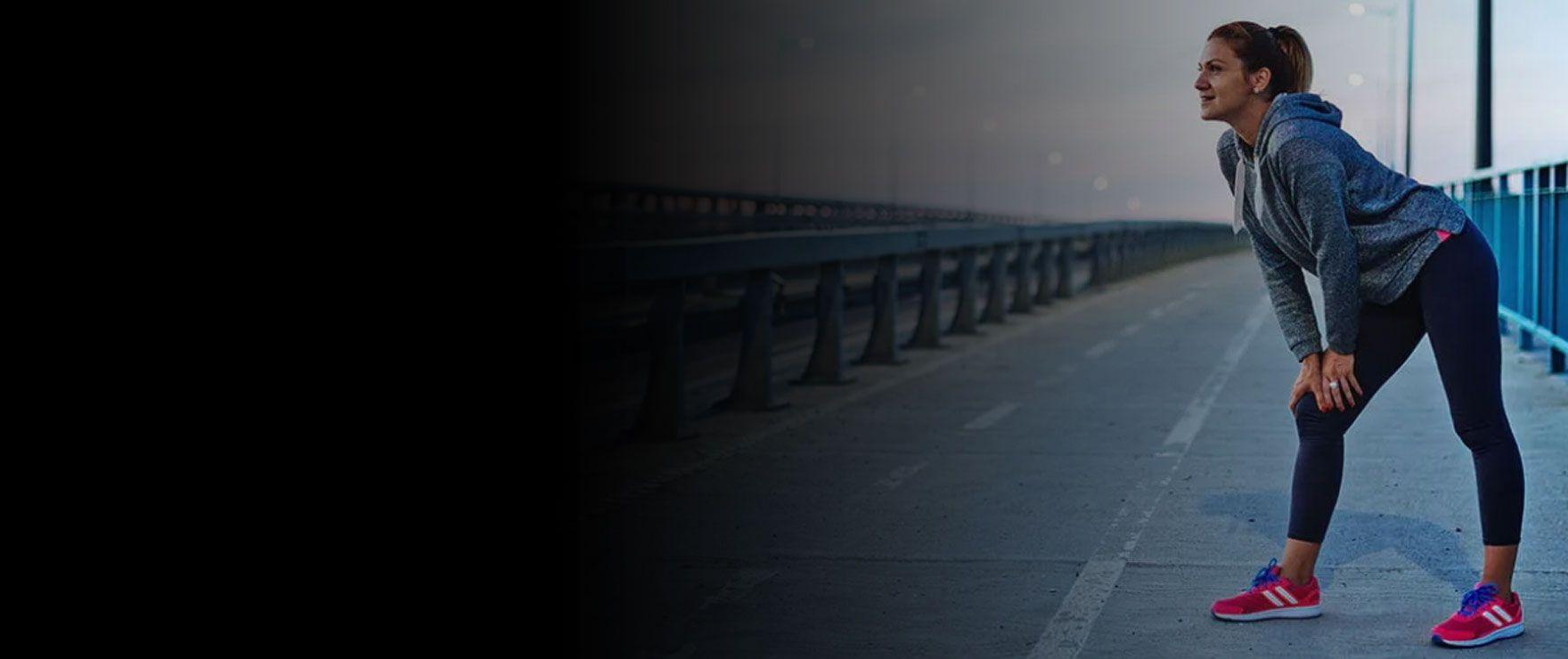 Runner on a bridge